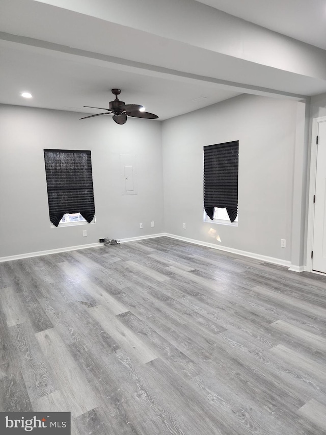 unfurnished room featuring ceiling fan and light hardwood / wood-style flooring