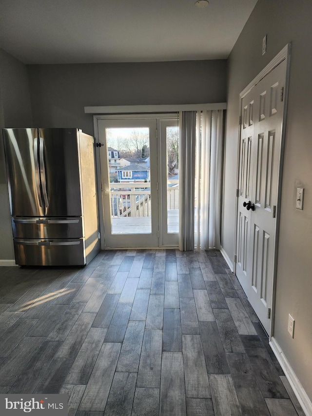 entryway with dark wood-type flooring