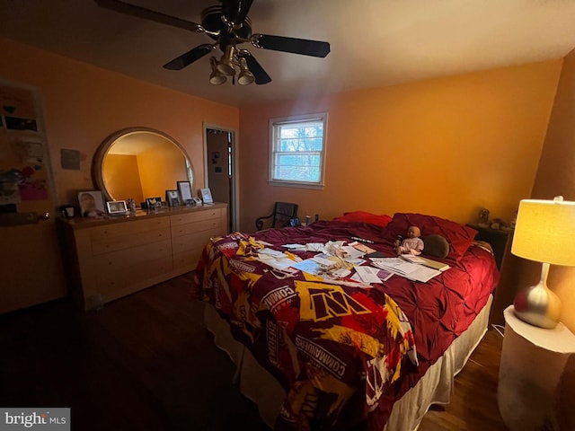 bedroom featuring ceiling fan and dark hardwood / wood-style flooring