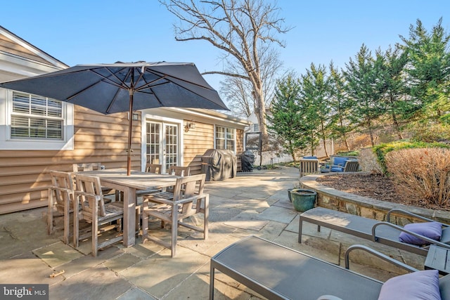 view of patio / terrace featuring a grill and french doors