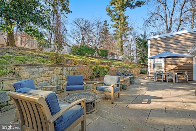 view of patio featuring an outbuilding