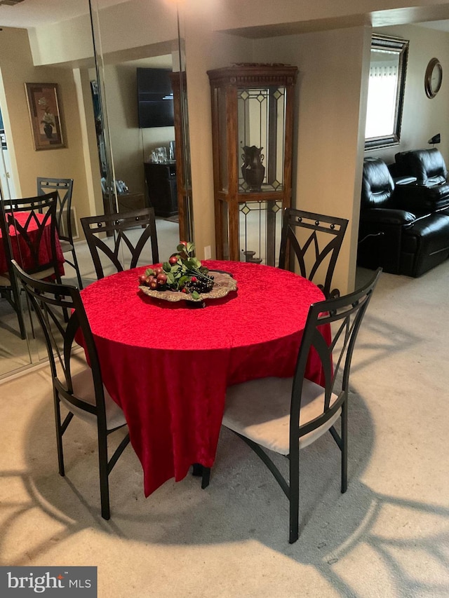 view of carpeted dining space