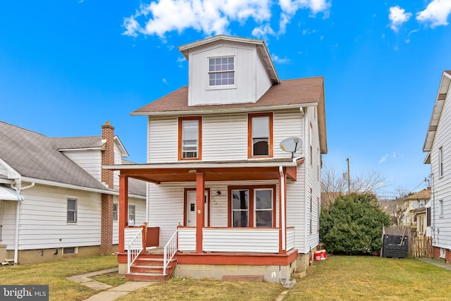 view of front of house featuring a porch and a front yard