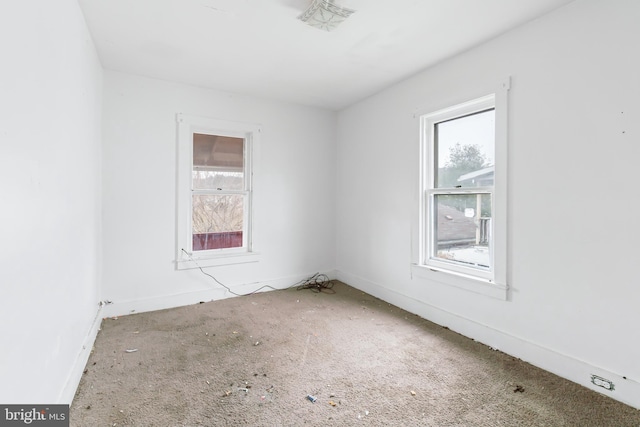 unfurnished room featuring a wealth of natural light