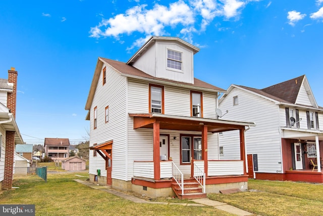 view of front facade featuring a porch and a front yard