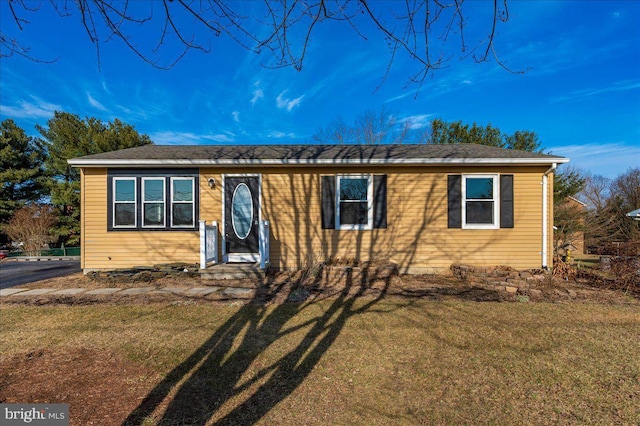 view of front of home with a front lawn