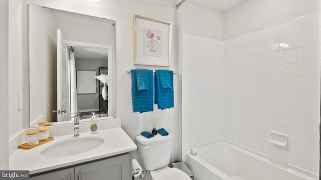 full bathroom featuring vanity, shower / washtub combination, and toilet