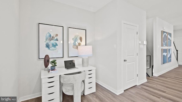 home office with light wood-type flooring