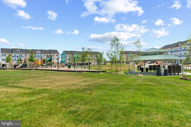 view of community with a gazebo, a lawn, and a playground