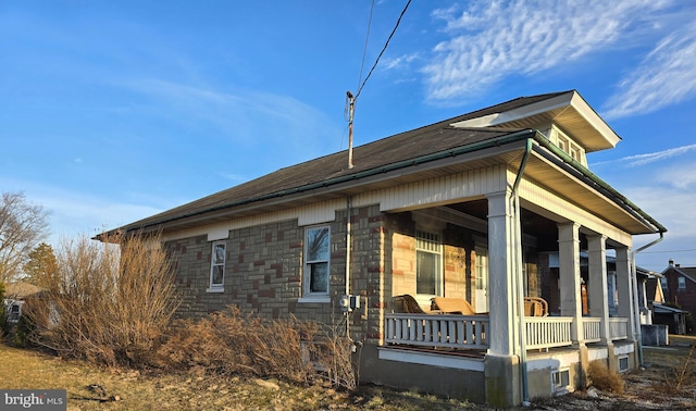 view of property exterior with a porch