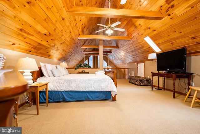 bedroom featuring carpet floors, vaulted ceiling with skylight, and wooden ceiling