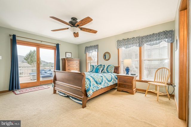 bedroom featuring ceiling fan, access to exterior, and light carpet