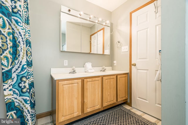 bathroom featuring tile patterned floors and vanity