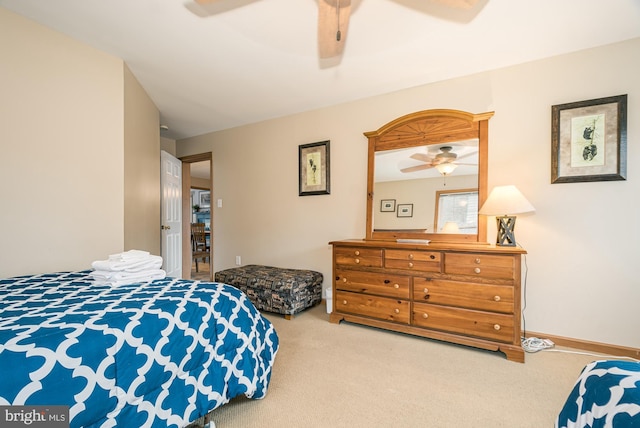 bedroom with ceiling fan and carpet