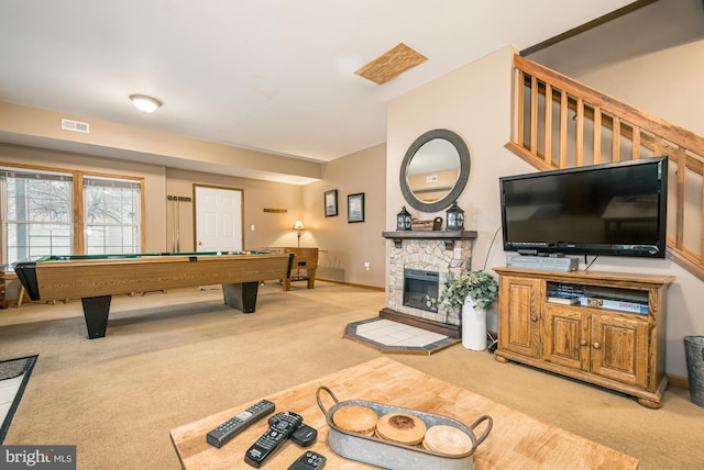 recreation room featuring a stone fireplace, carpet flooring, and billiards