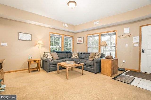 living room with light carpet and plenty of natural light