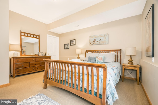 bedroom with light colored carpet