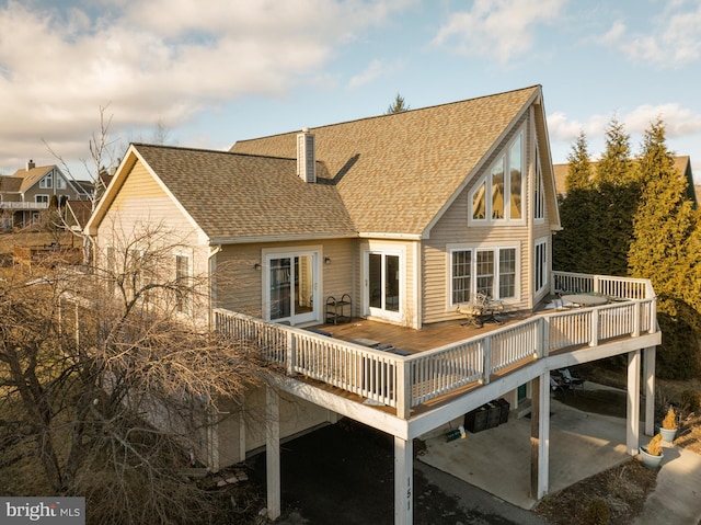 back of property featuring a wooden deck