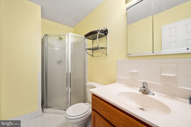 bathroom featuring toilet, an enclosed shower, vaulted ceiling, vanity, and tile patterned flooring