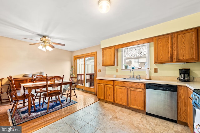 kitchen featuring ceiling fan, stainless steel dishwasher, and sink