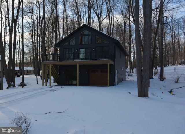 view of front of property with stairs and a deck