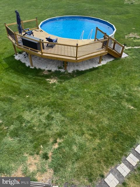 65 Campbell Rd, York, PA 17402 - outdoor pool with a wooden deck and a yard
