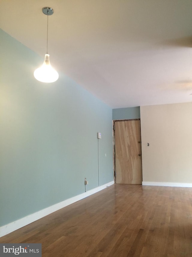 unfurnished room featuring hardwood / wood-style flooring