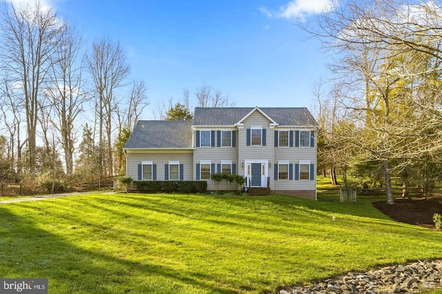 colonial-style house with a front yard