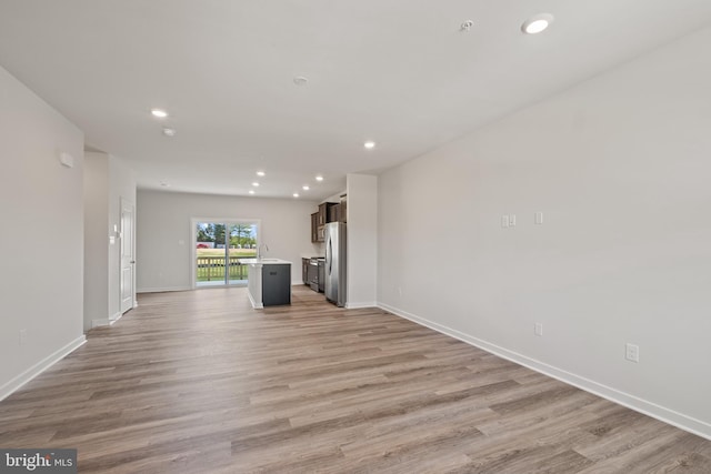 unfurnished living room featuring light wood-type flooring