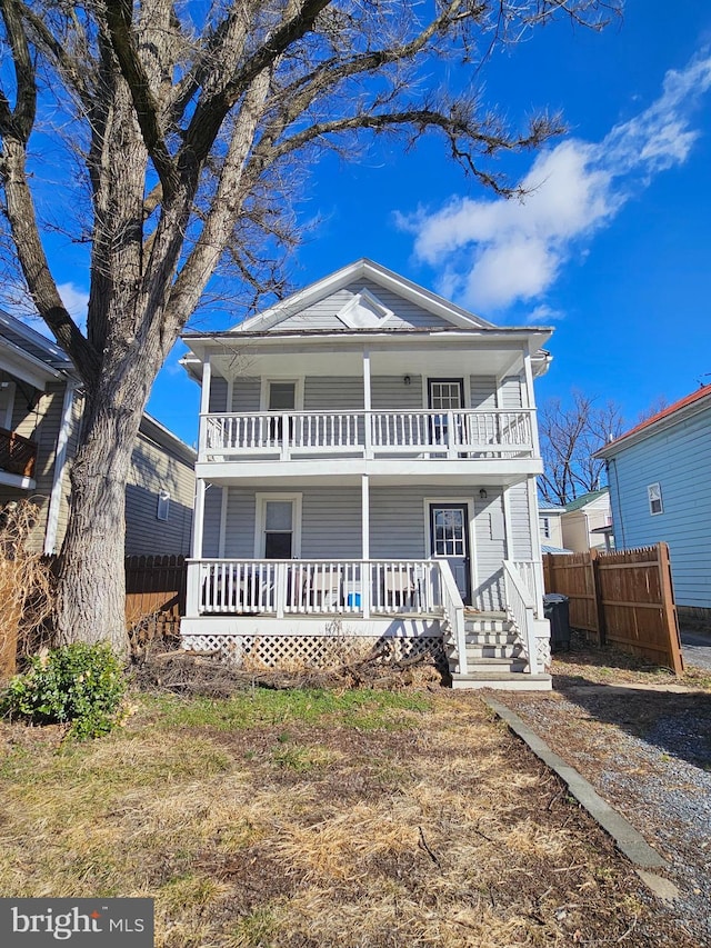 view of front of house featuring covered porch and a balcony