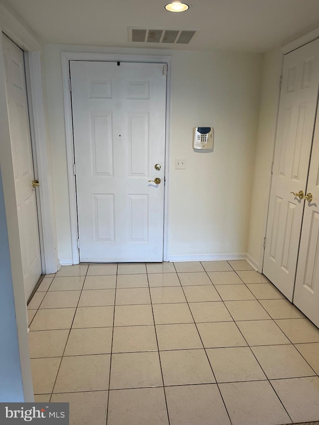 interior space with light tile patterned floors