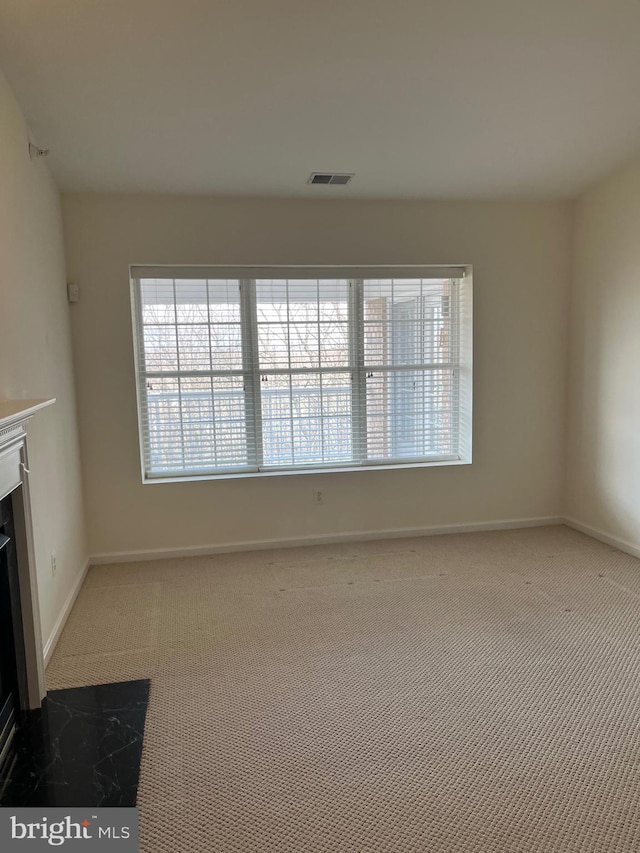 unfurnished living room with carpet floors