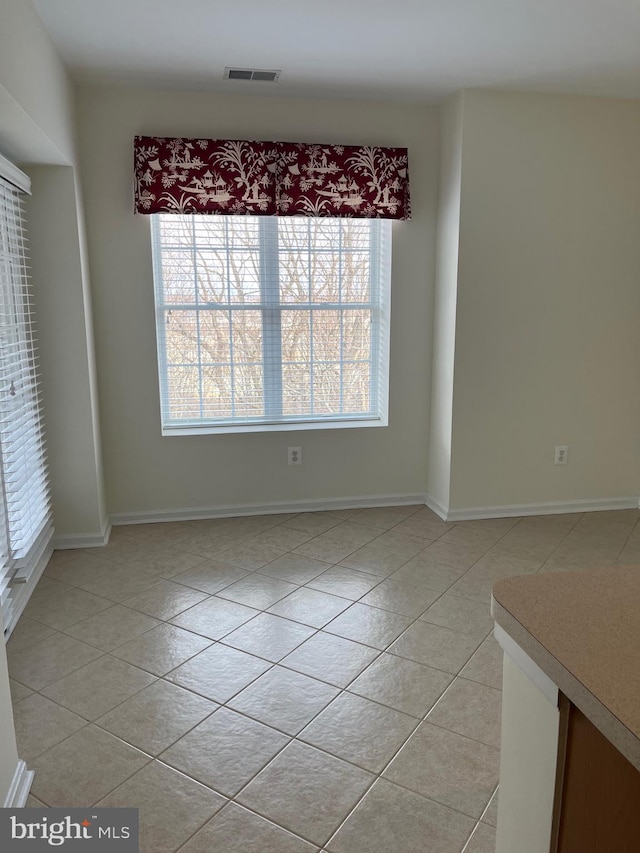 interior space featuring a healthy amount of sunlight and light tile patterned floors