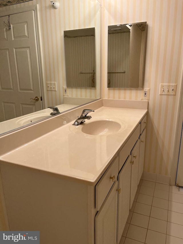 bathroom featuring tile patterned flooring and vanity