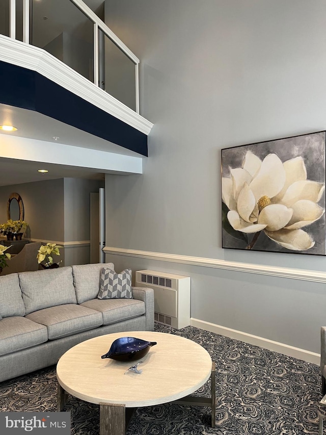 living room with a towering ceiling