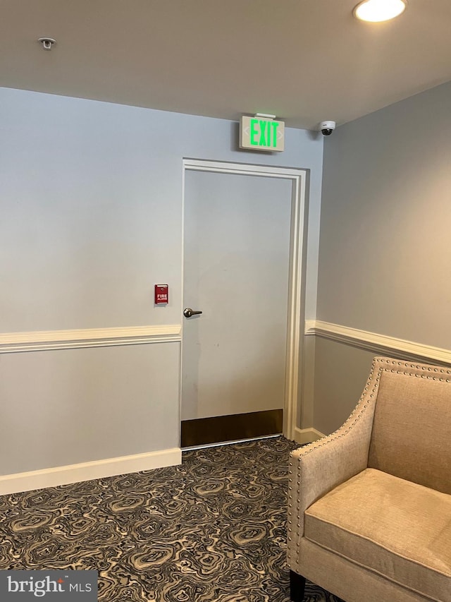 unfurnished room featuring dark tile patterned flooring