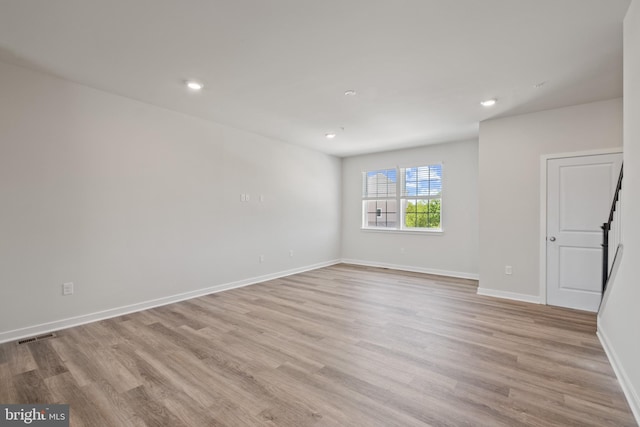 spare room with light wood-type flooring