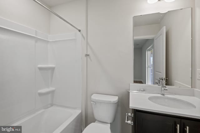 full bathroom featuring vanity, toilet, and washtub / shower combination