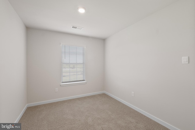 spare room with carpet flooring