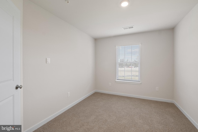 empty room featuring carpet flooring