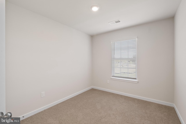 spare room with carpet floors