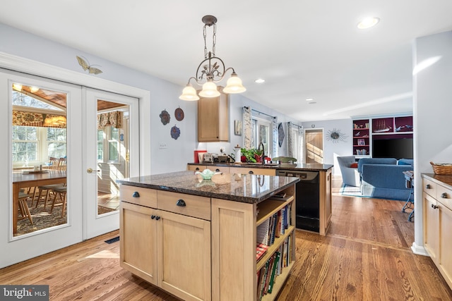 kitchen with a center island, french doors, light brown cabinets, and dishwasher