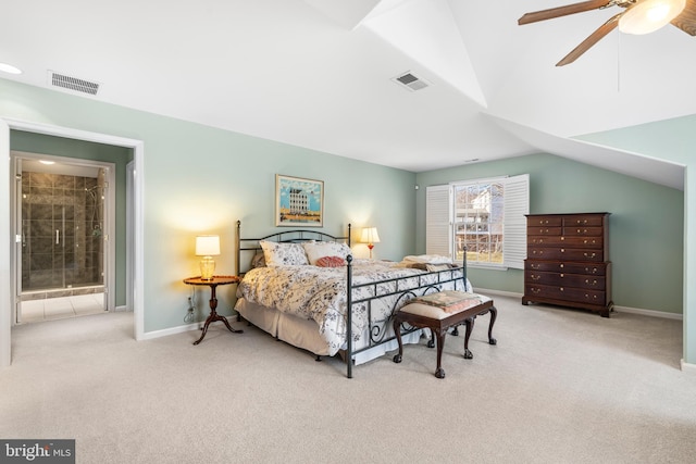 bedroom with lofted ceiling, visible vents, and light carpet