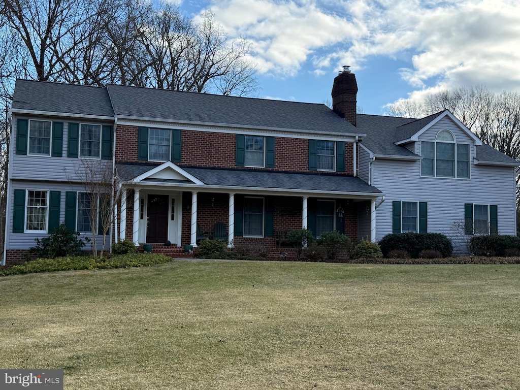 view of front of home featuring a porch and a front yard