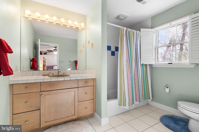 full bathroom featuring baseboards, toilet, shower / tub combo with curtain, tile patterned flooring, and vanity