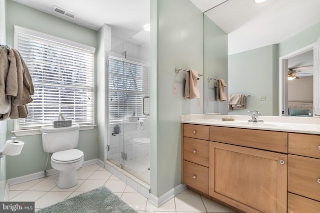 bathroom with a shower stall, vanity, visible vents, and tile patterned floors