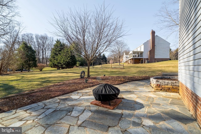 view of patio / terrace with a fire pit