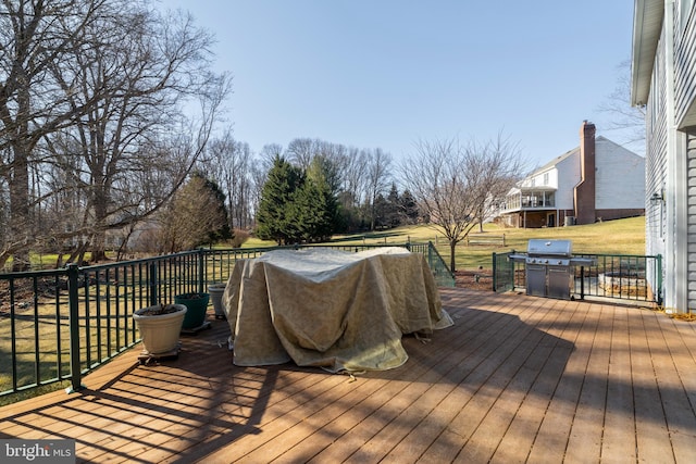 wooden terrace with a yard