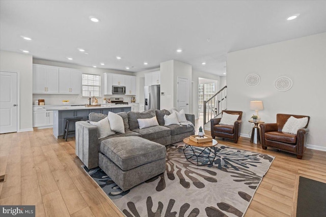 living room with light hardwood / wood-style floors