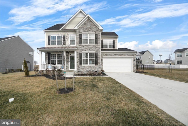 view of front of house with a porch, a garage, and a front yard